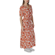 A flowing long-sleeved b.young floral v-neck dress in vibrant orange leaf pattern on light beige viscose fabric