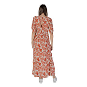 A flowing long-sleeved maxi dress in vibrant orange and cream leaf print made of 100 percent viscose by byoung