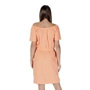 A peach-colored b.young orange polka dot short dress with off-the-shoulder neckline and subtle textured pattern