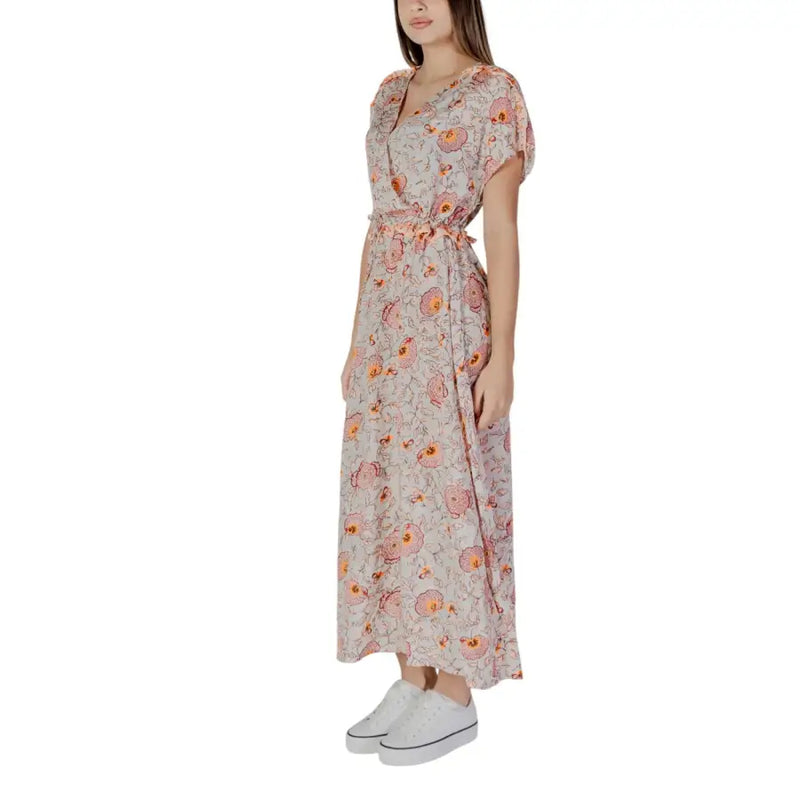 A flowing light pink floral cotton maxi dress with short flutter sleeves and self-tie waistband by B.young