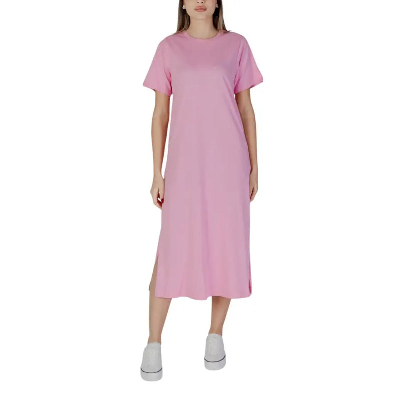 A soft pink b.young short cotton dress with round neck, relaxed fit, short sleeves, midi length, and side slit