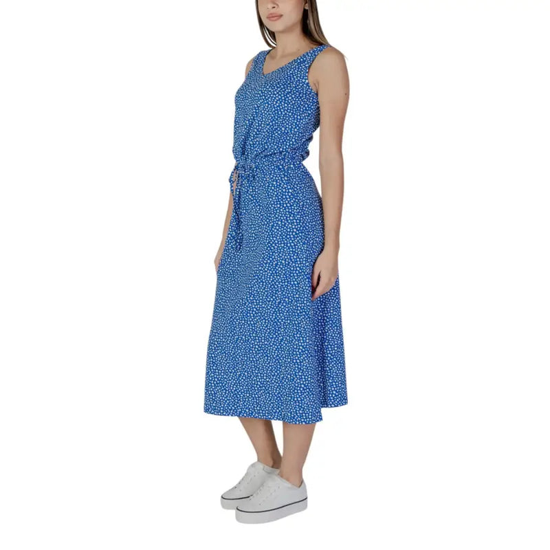A blue sleeveless midi dress by B.young with white polka dots and a self-tie waistband