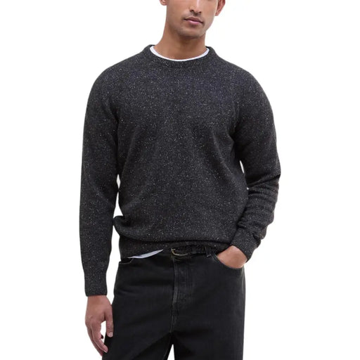 Black speckled crewneck sweater with white trim, cotton blend material.