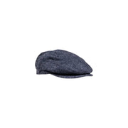Navy blue flat cap with textured fabric and a classic design.