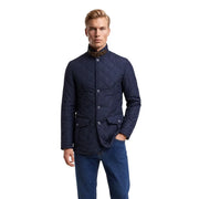 Veste matelassée Barbour Lutz pour homme, bleu marine, col montant et bordure en cuir marron au niveau du cou, vue de face