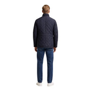 Veste matelassée Barbour Lutz pour homme, bleu marine foncé, à motif matelassé en losanges et col structuré, vue de face