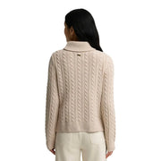 Barbour women wool blend Ambleside knitted jumper beige cable knit turtleneck sweater with gold brand tag at neckline