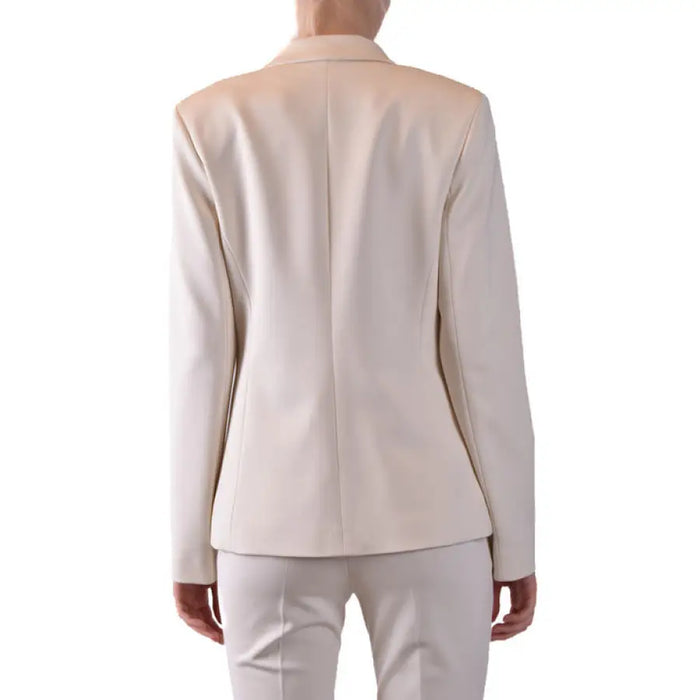 Beige women’s double-breasted blazer and pants suit for professional attire