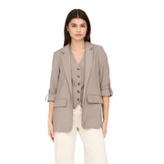 Beige blazer suit with rolled-up sleeves and gold-toned buttons