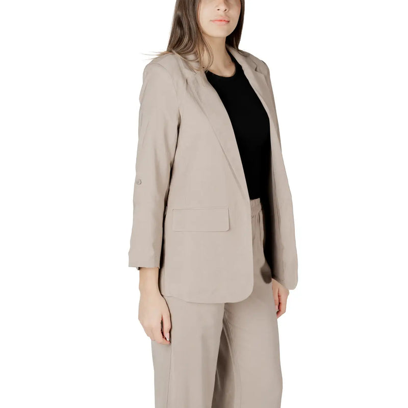 Beige blazer suit with a sleek tailored fit and subtle textured fabric perfect for formal wear