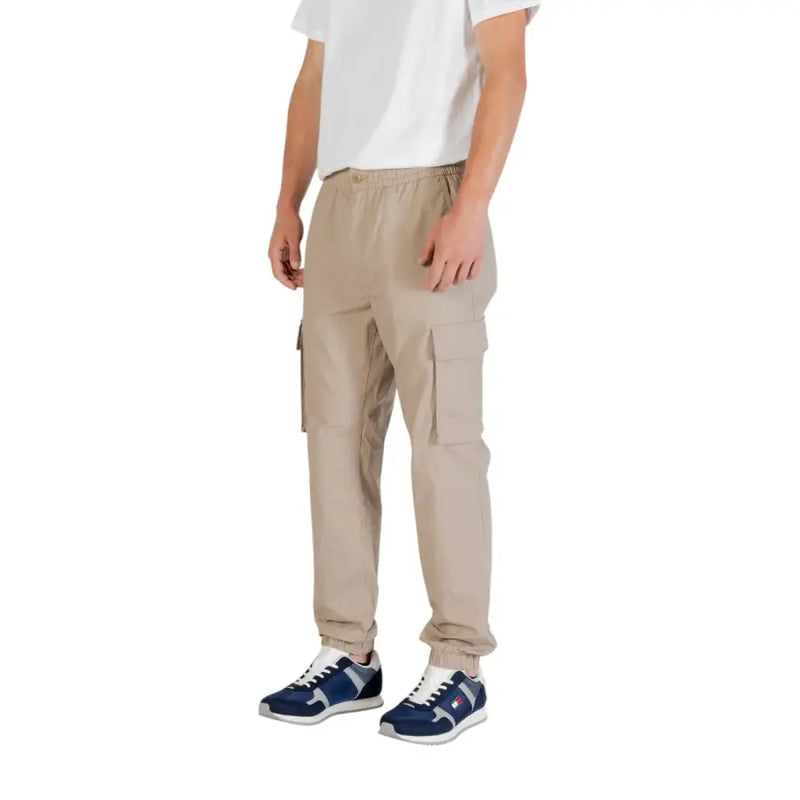 Beige cargo pants from calvin klein jeans featuring an elastic waistband and side pockets for casual wear