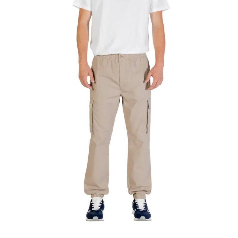 Beige cargo pants from Calvin Klein Jeans with side pockets and elastic cuffs for casual and functional wear
