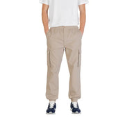 Beige cargo pants from calvin klein jeans featuring side zippers and elastic cuffs for a comfortable fit