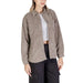 Beige corduroy button-up shirt jacket over white crop top from Jacqueline De Yong