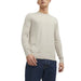 Beige crew-neck sweater paired with dark blue jeans for a casual stylish look