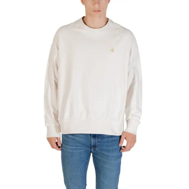 Sweat-shirt beige à col rond couleur crème avec logo Calvin Klein brodé discrètement en doré sur la poitrine