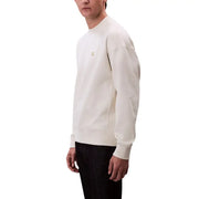 Sweat-shirt beige à col rond couleur crème orné de subtils détails dorés Calvin Klein logo sur la poitrine