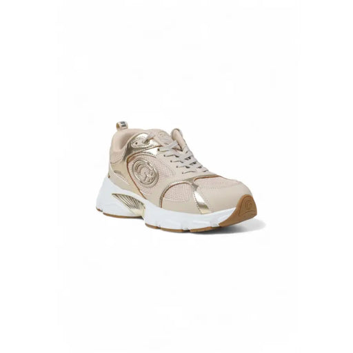 Beige and gold women’s athletic slip-on sneaker with thick white sole from Guess