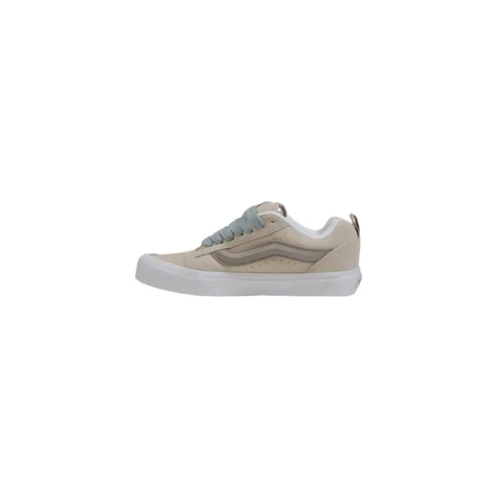 Beige and gray Vans sneaker displayed for sale in a product listing