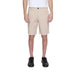 Beige knee-length Armani Exchange shorts paired with black sneakers for men