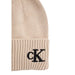Beige knit beanie with black CK logo and pompom for stylish winter wear