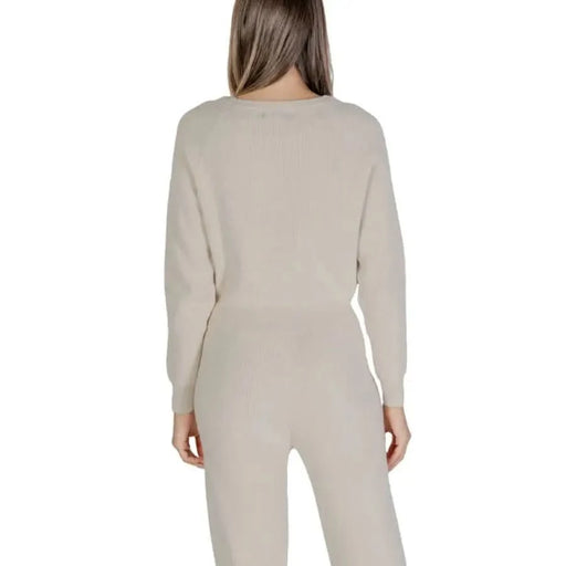 Beige knit sweater and pants set from Clerè featuring a round neck design