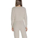 Beige knit sweater and pants set from Clerè featuring a round neck design