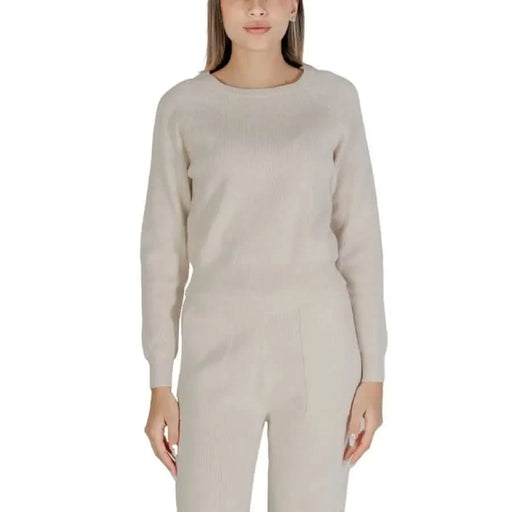 Beige knit sweater and pants set featuring Clerè Women’s Round Neck design
