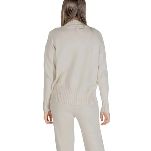Beige knit sweater and pants set from Clerè Women’s collection for stylish comfort