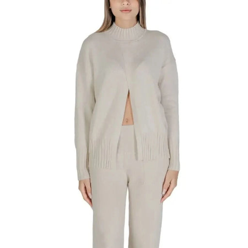 Beige knit sweater and pants set from Clerè Women’s collection in stylish design