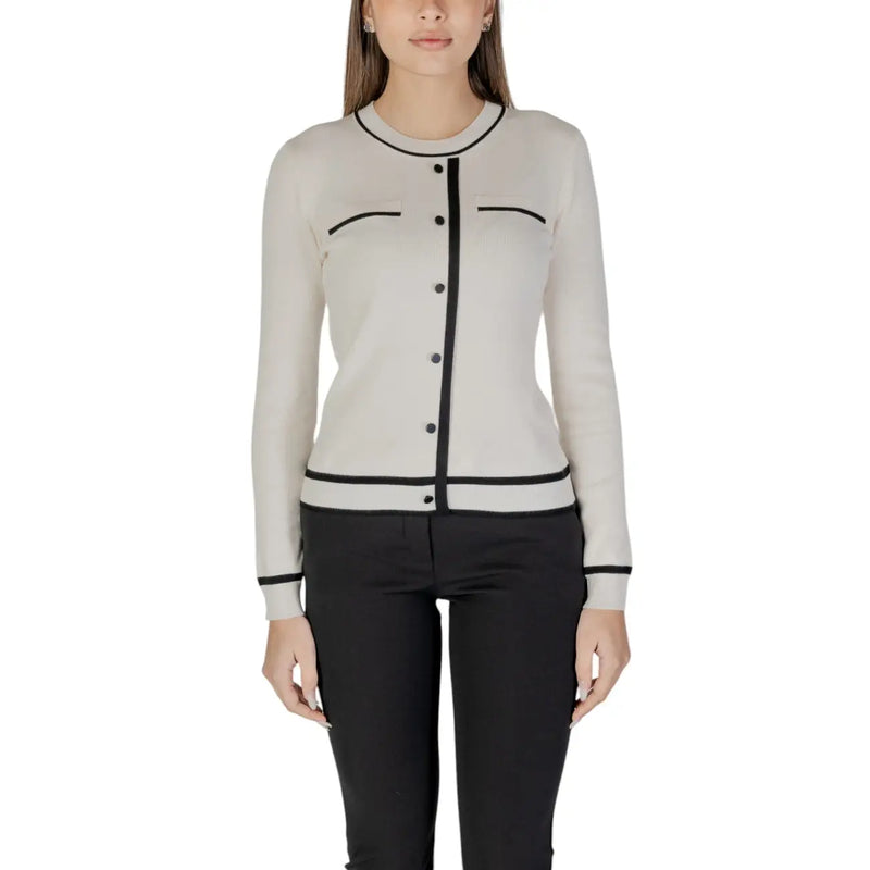 Beige long sleeve knit cardigan with black trim and front pockets