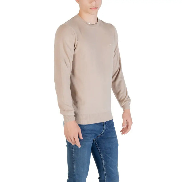 Beige long-sleeved sweater paired with Blue Jeans displayed in product image