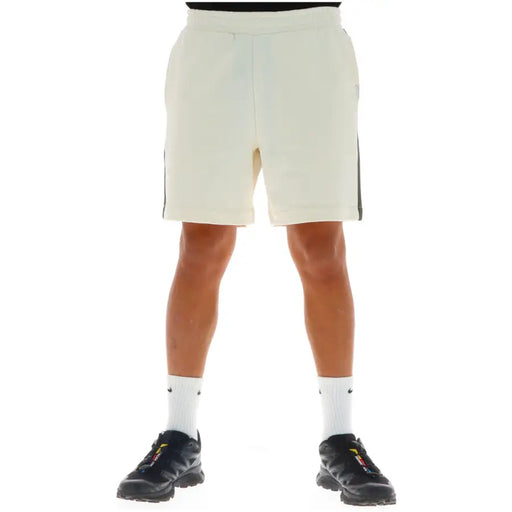 Beige athletic shorts with dark green side stripes and a drawstring waistband suitable for activewear