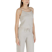 Beige sleeveless round neck polyester top for women with delicate spaghetti straps and a relaxed fit in light gray