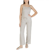 Beige sleeveless round neck polyester top with thin straps paired with matching wide-leg pants featuring a drawstring waist
