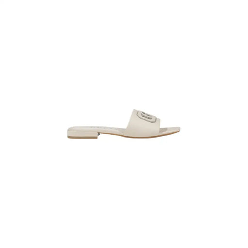 Beige slide sandal with logo showcasing a stylish casual footwear option