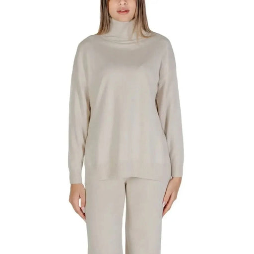 Beige turtleneck sweater and pants set from Clerè Women’s Knitwear for Fall/Winter