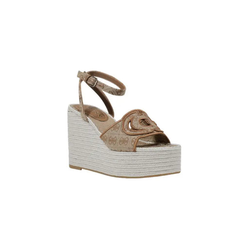 Beige patterned wedge sandal with ankle strap; stylish footwear for warm weather