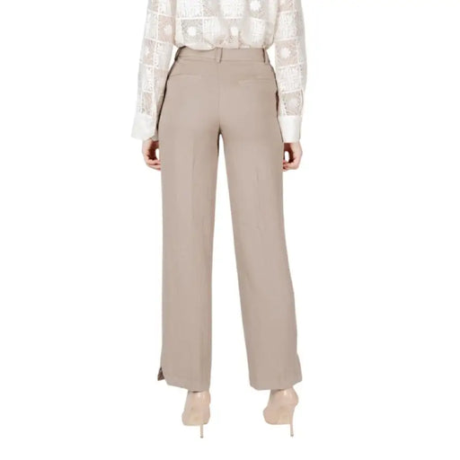 Beige wide-leg trousers displayed elegantly for sophisticated fashion choices