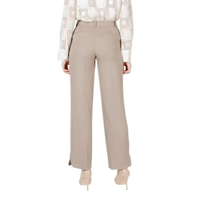 Beige wide-leg trousers displayed elegantly for sophisticated fashion choices