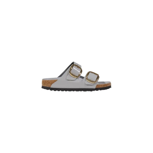 Light gray Birkenstock womens leather slippers with gold buckles and cork footbed