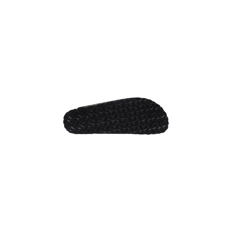 Black rubber sole with textured patterned tread design on the back side of birkenstock women leather sandals black arizona
