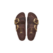 Brown leather Birkenstock Arizona women sandals featuring gold-tone double buckle straps for comfortable wear