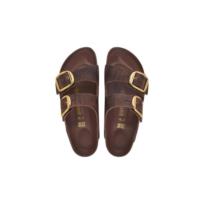 Brown leather Birkenstock Arizona women sandals featuring gold-tone double buckle straps for comfortable wear