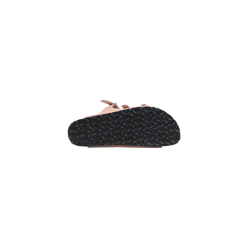 Birkenstock women pink leather slippers buckle with black rubber sole featuring a wavy tread pattern