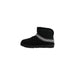 Black leather ankle boots for women featuring a decorative band, perfect for Fall Winter