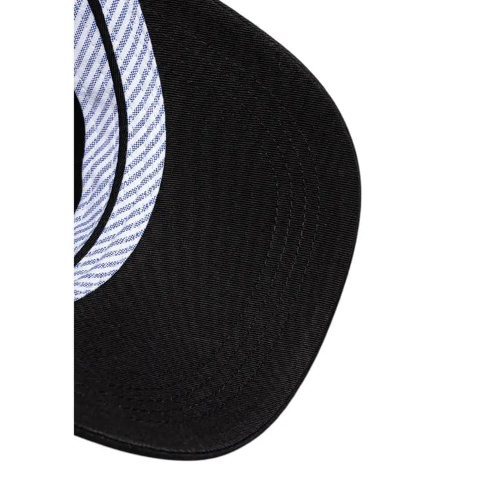 Black baseball cap featuring striped lining and a logo design