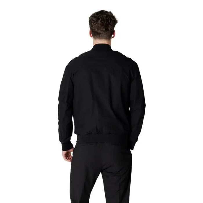 Black bomber jacket with matching black pants displayed as a stylish outfit
