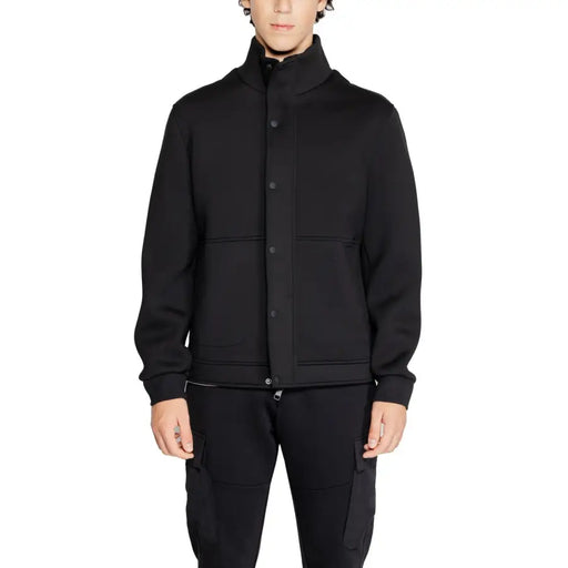 Black button-up jacket displayed in the Black Button Up Jacket and Pants Ensemble