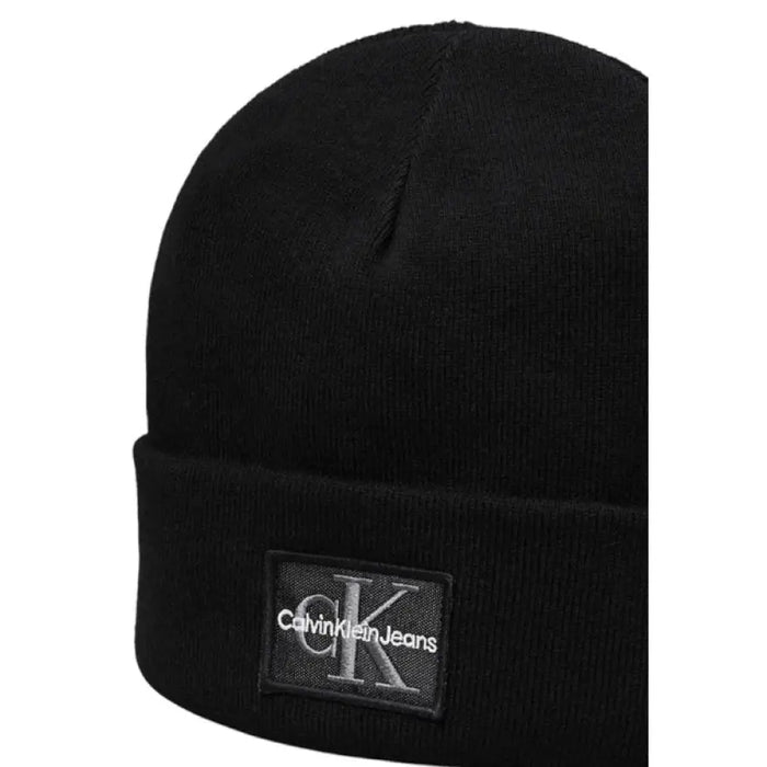 Black Calvin Klein beanie showcasing a modern and stylish design for winter wear